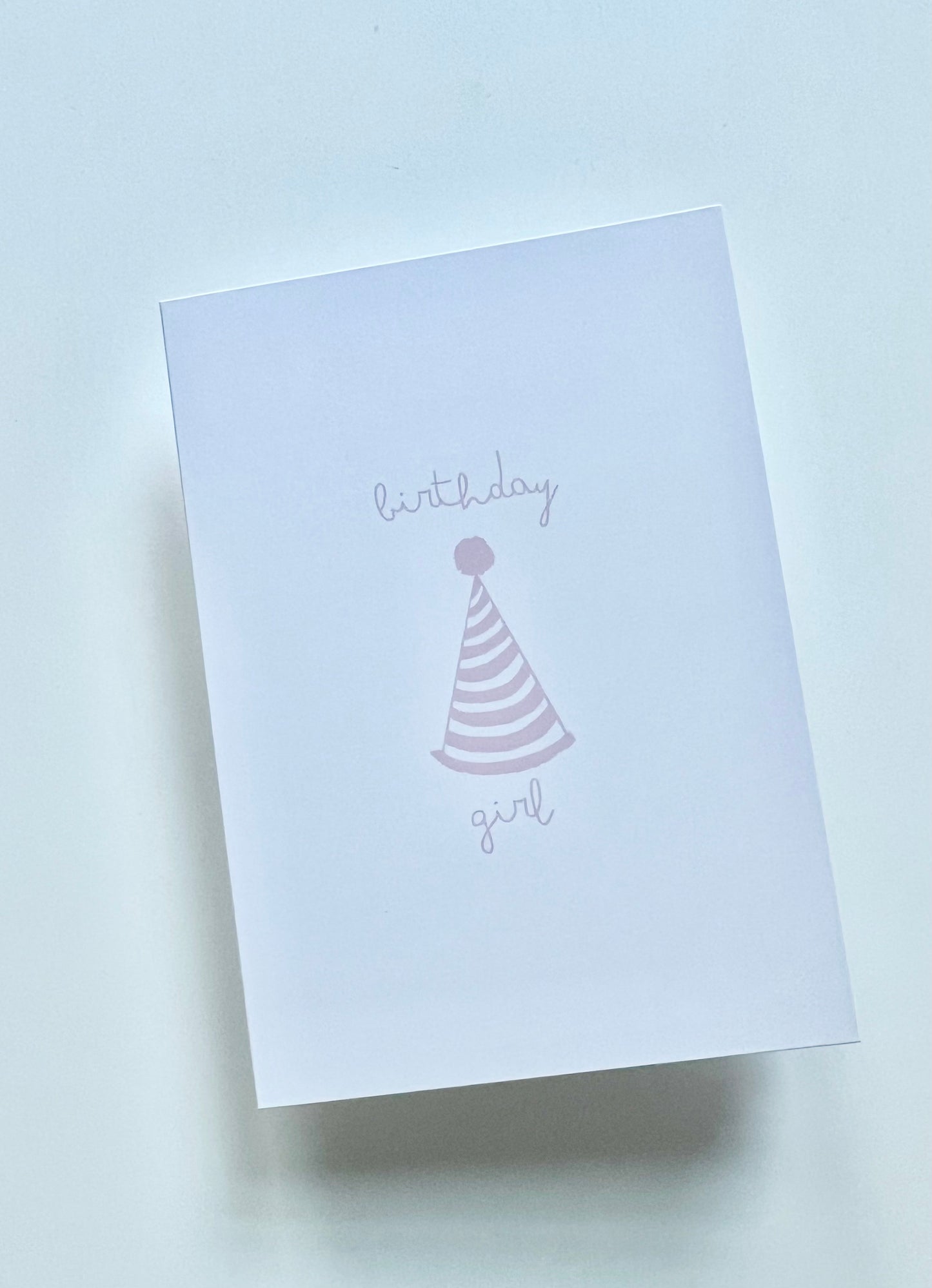 hand drawn happy birthday greeting card with pink party hat that says birthday girl.