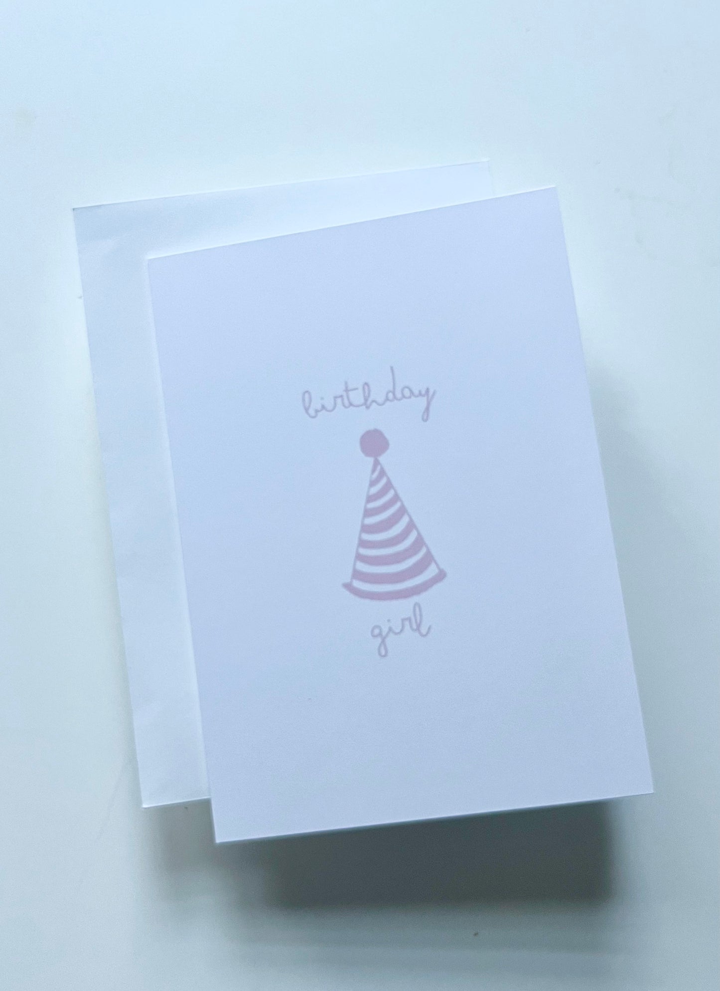 hand drawn happy birthday greeting card with pink party hat that says birthday girl.