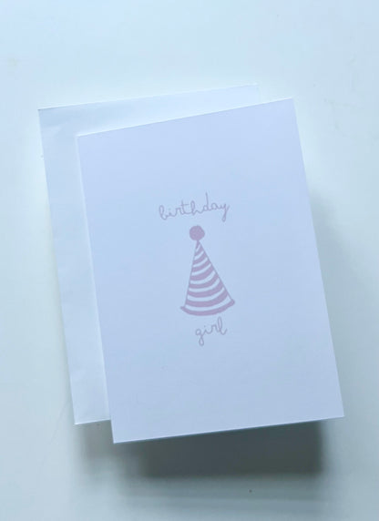hand drawn happy birthday greeting card with pink party hat that says birthday girl.