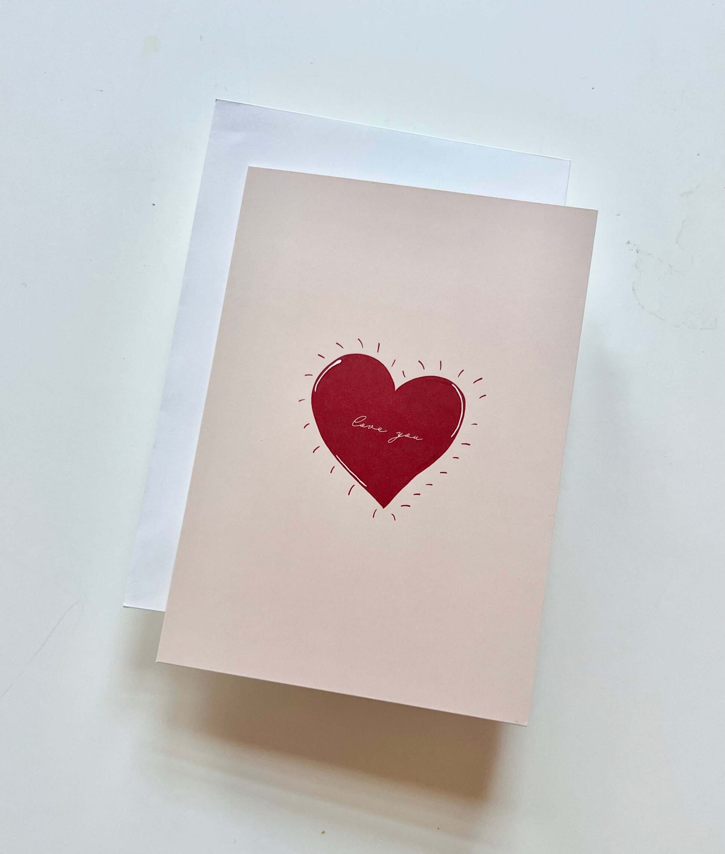 hand drawn valentine's anniversary love greeting card with a red heart that says love you.