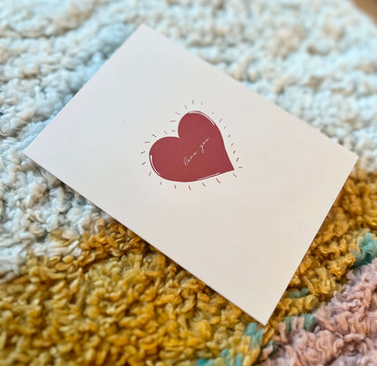 hand drawn valentine's anniversary love greeting card with a red heart that says love you.