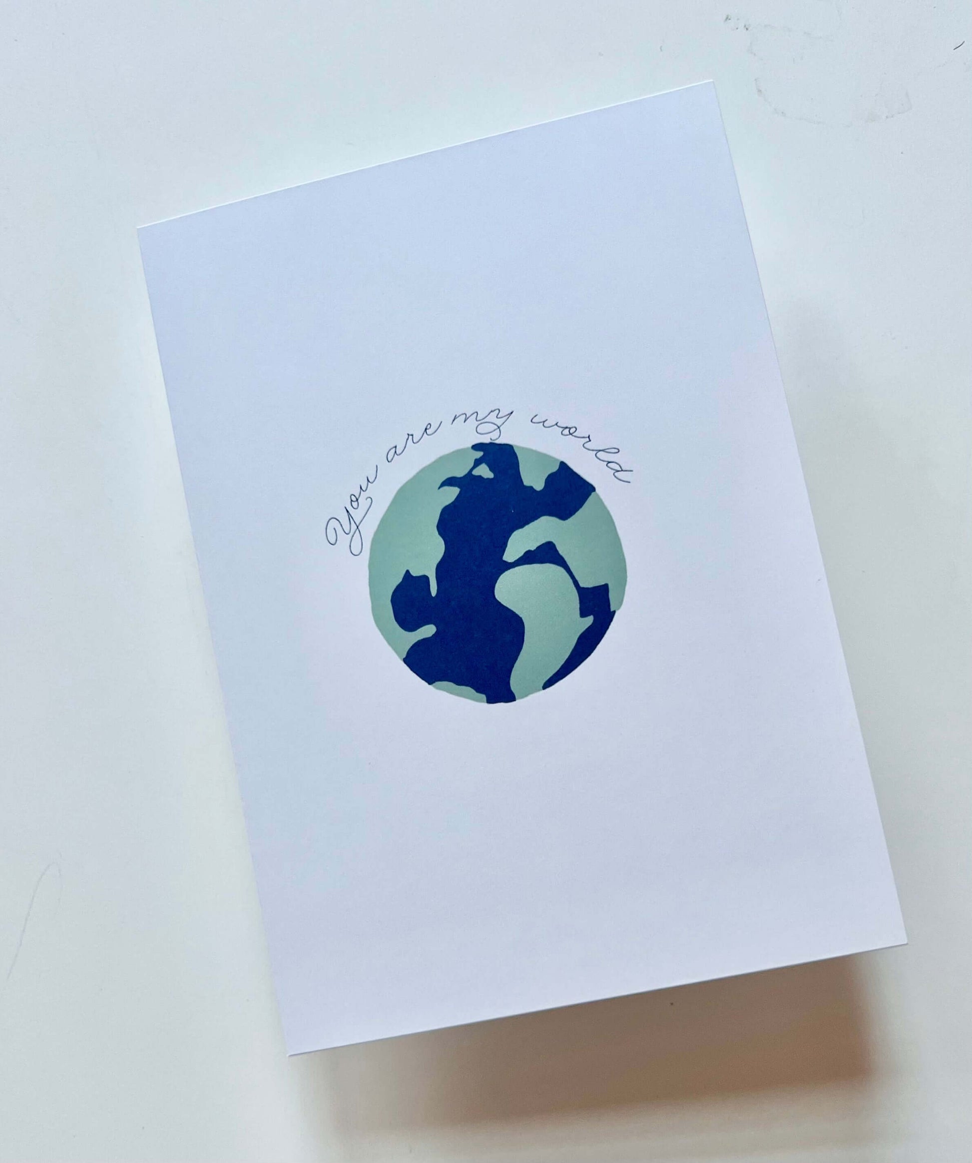 hand drawn anniversary valentines wedding greeting card that says you are my world with a earth. 