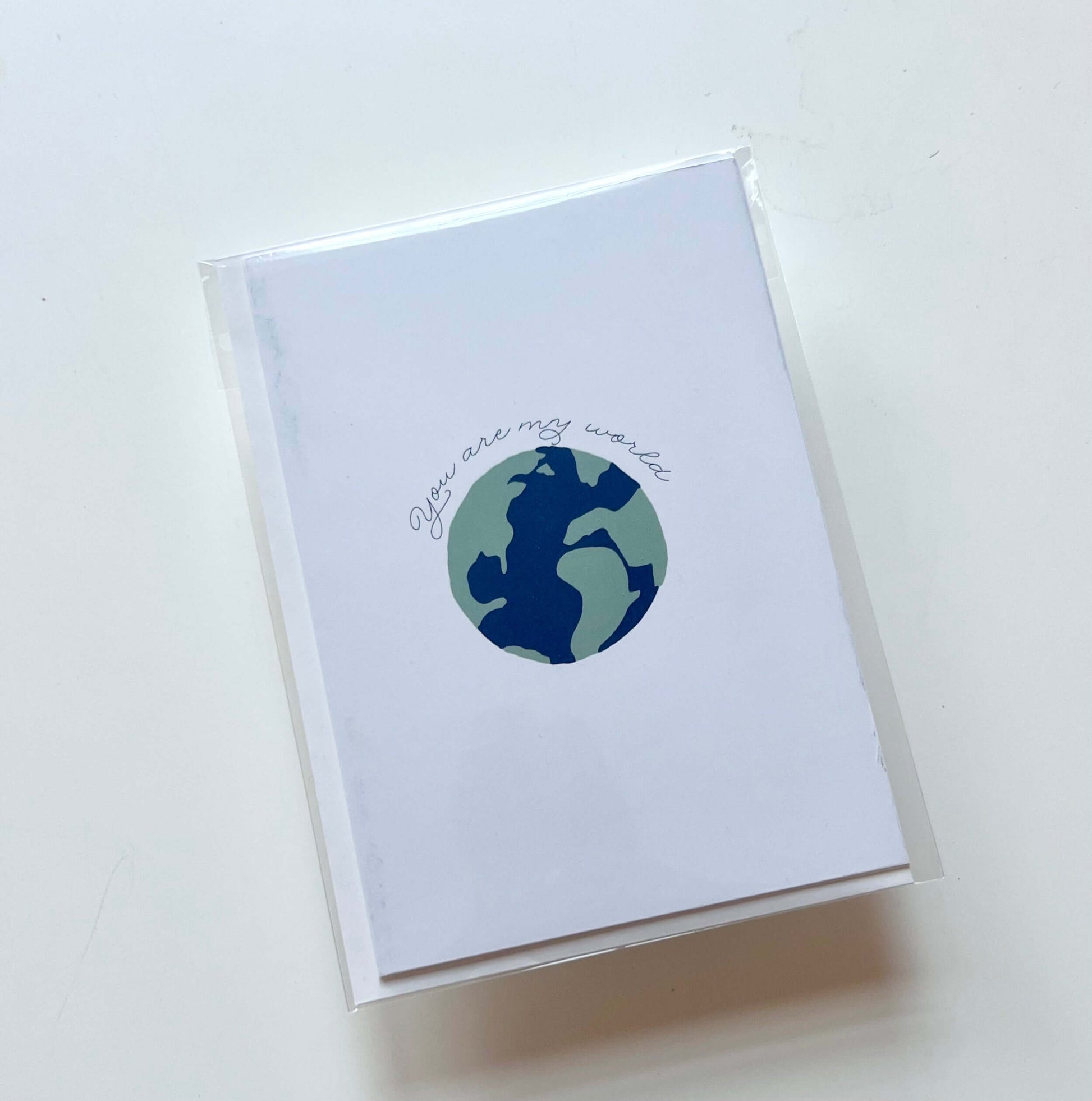 hand drawn anniversary valentines wedding greeting card that says you are my world with a earth. 