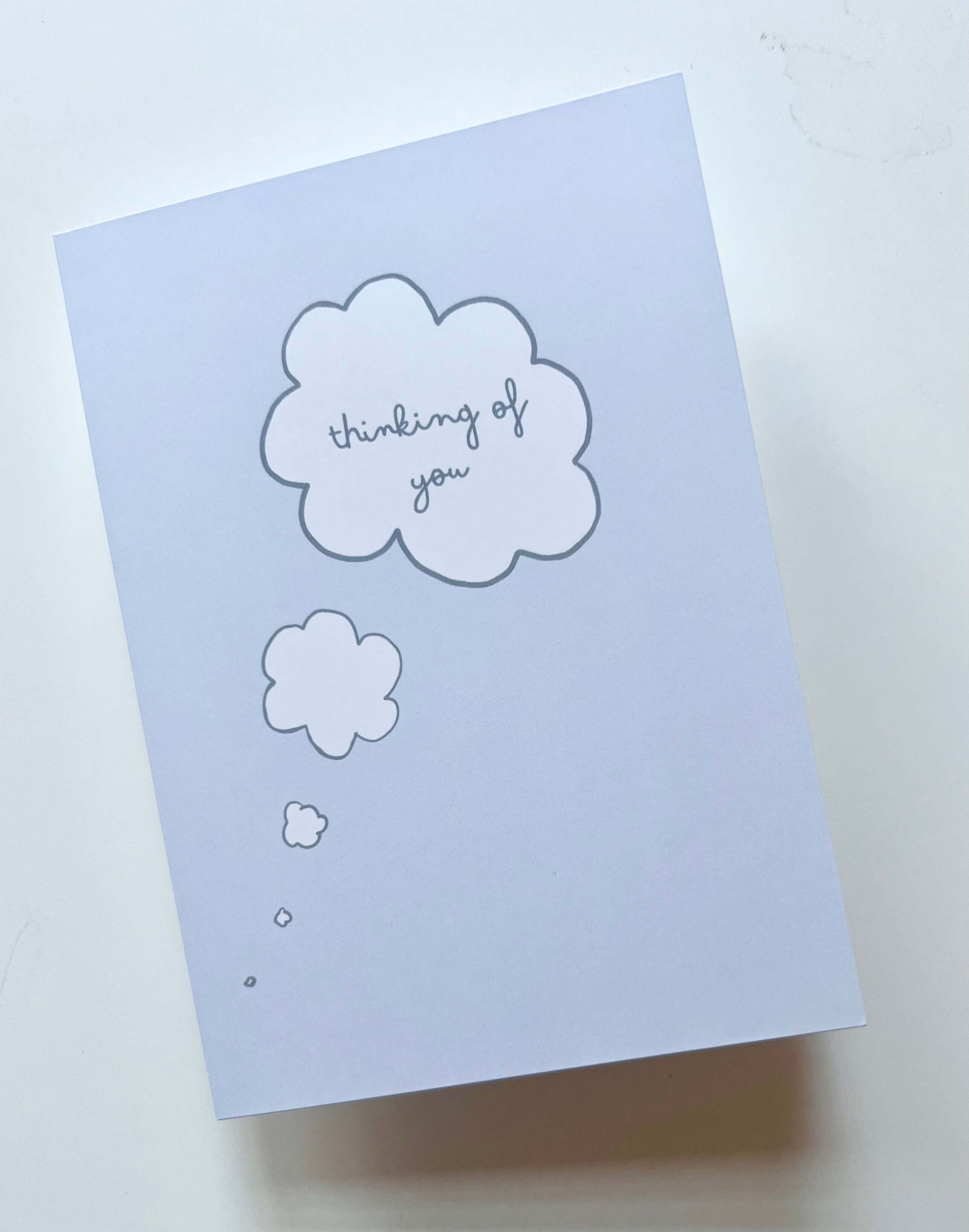 hand drawn blue thinking of you thought bubble greeting card.