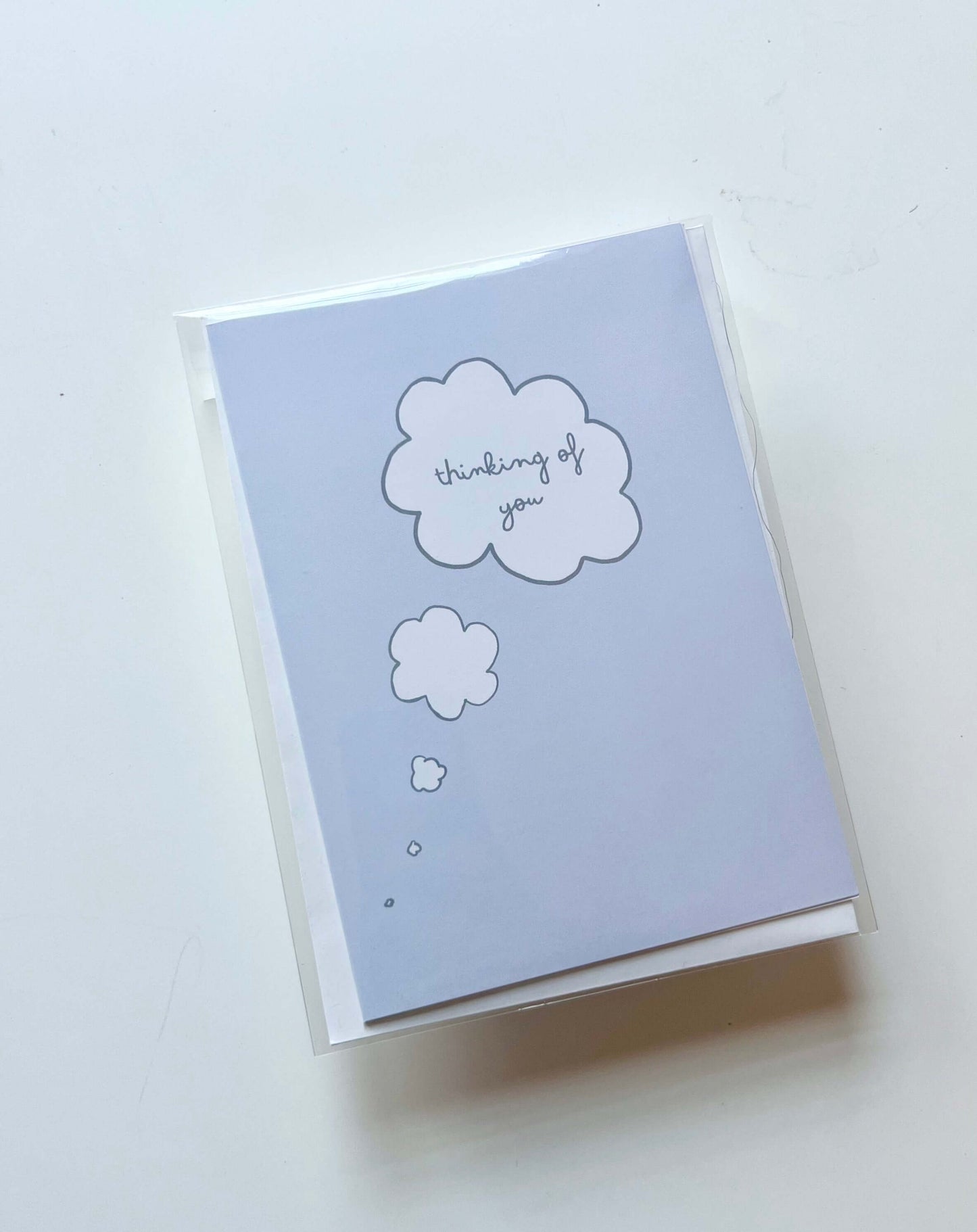 hand drawn blue thinking of you thought bubble greeting card.