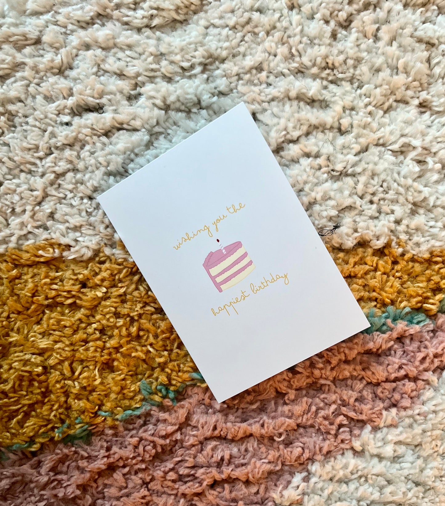 hand drawn greeting card with a piece of cake that says wishing you the happiest birthday.