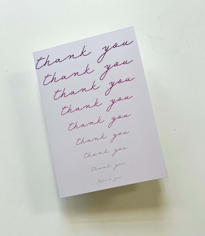 Fading pink thank you card featuring hand-drawn cursive text, blank inside, size 5.83 x 4.13 inches, wrapped in plastic.