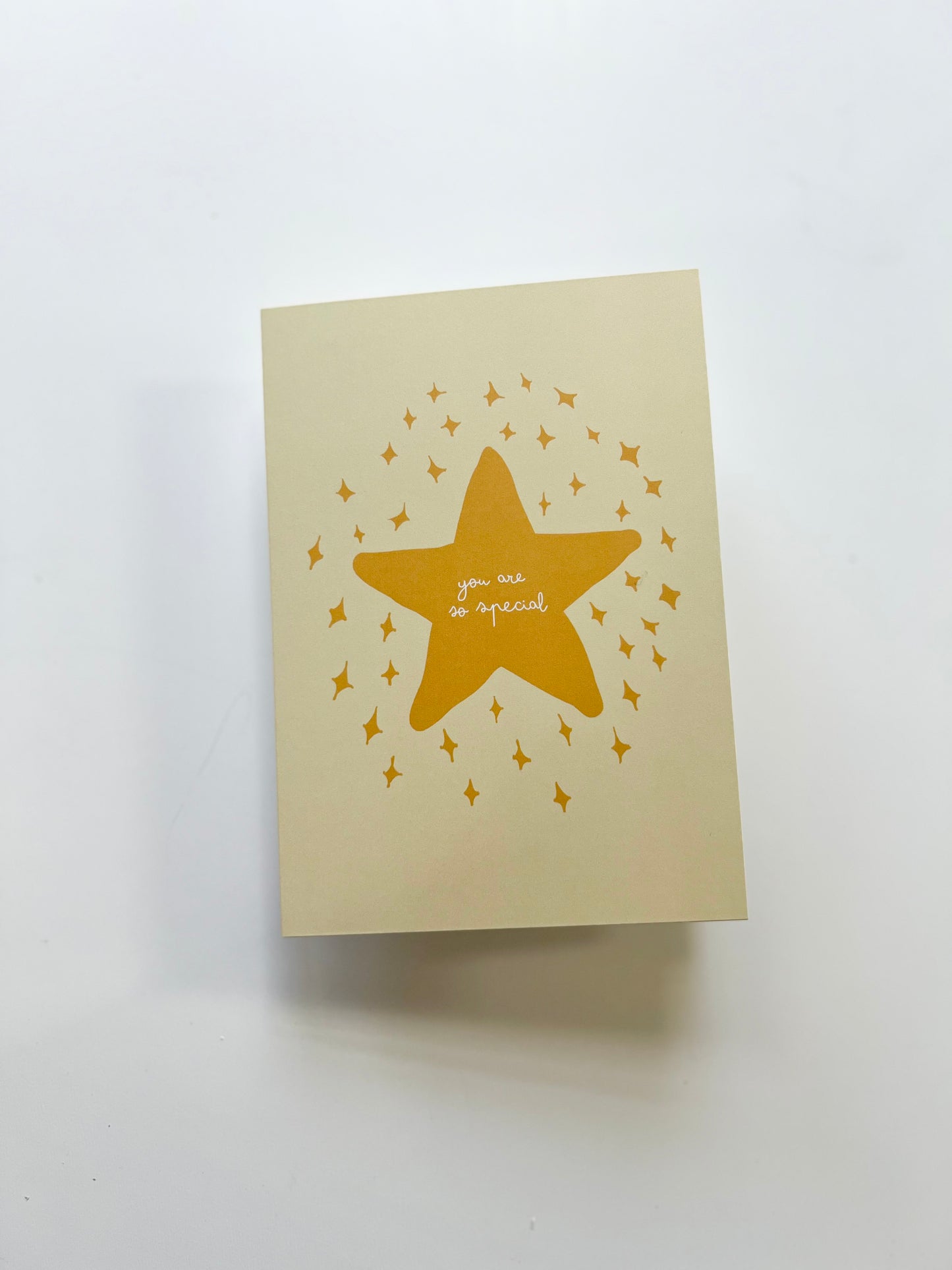 Yellow greeting card featuring a star with the message "you are so special" on a cream background.