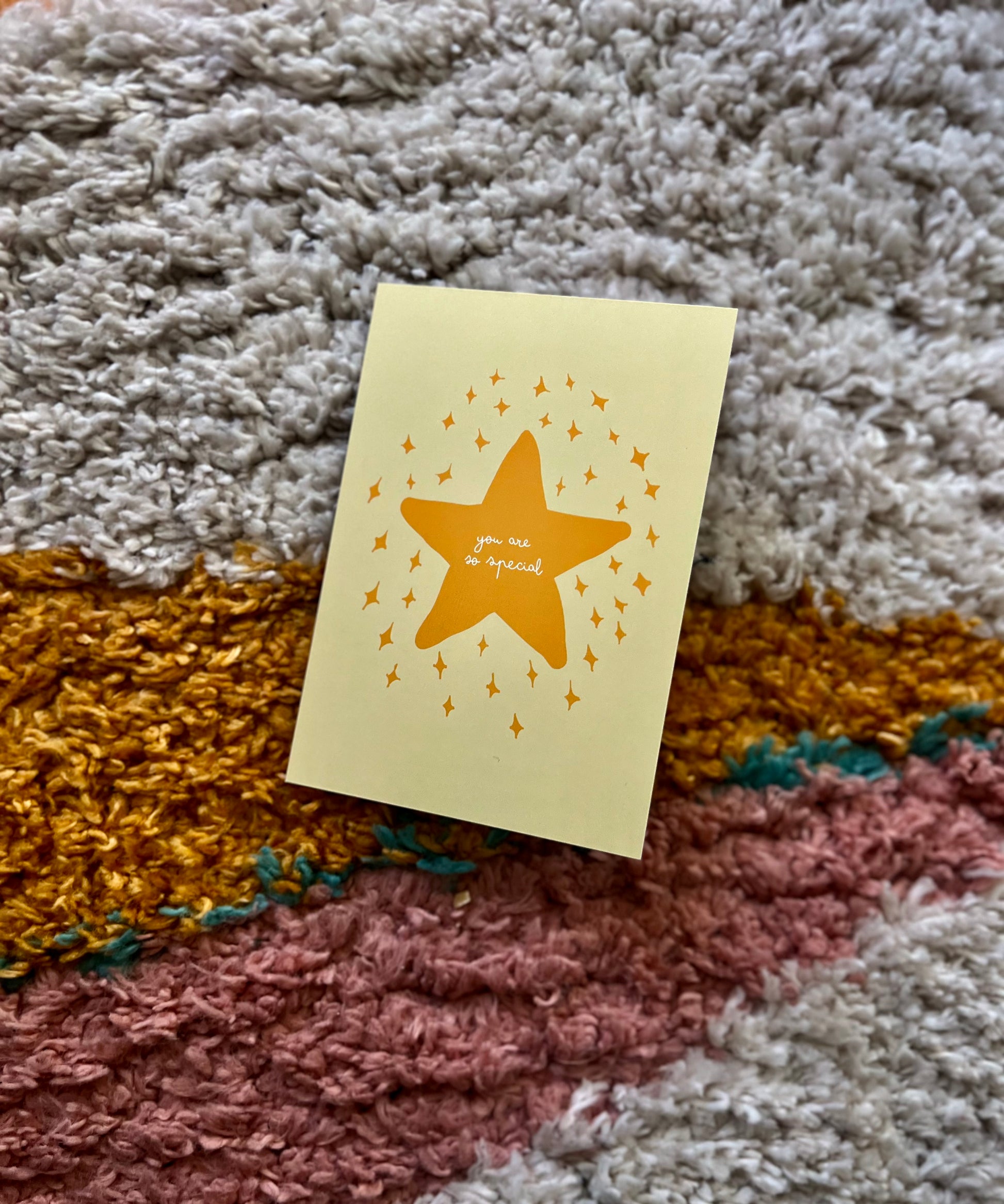 Yellow greeting card featuring a star design and the text "you are so special" on a textured background.