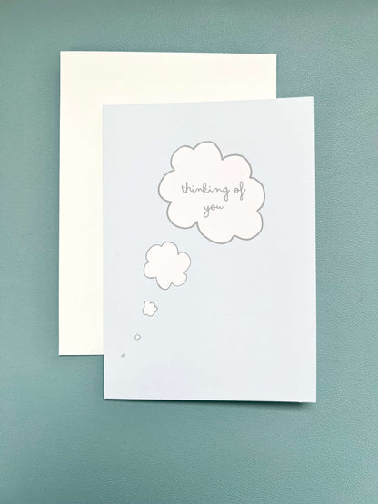 hand drawn blue thinking of you thought bubble greeting card.