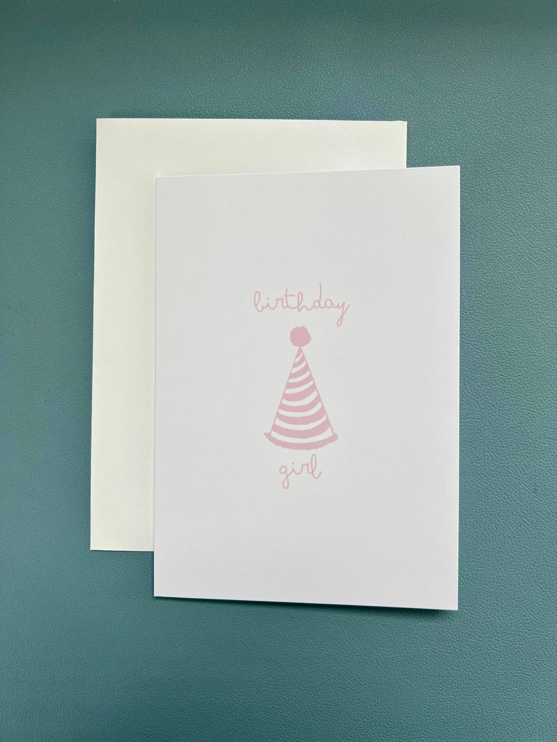 hand drawn happy birthday greeting card with pink party hat that says birthday girl.